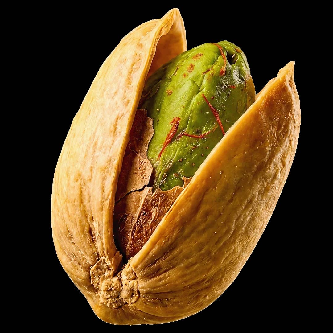 A saffron-threaded pistachio, split in its shell